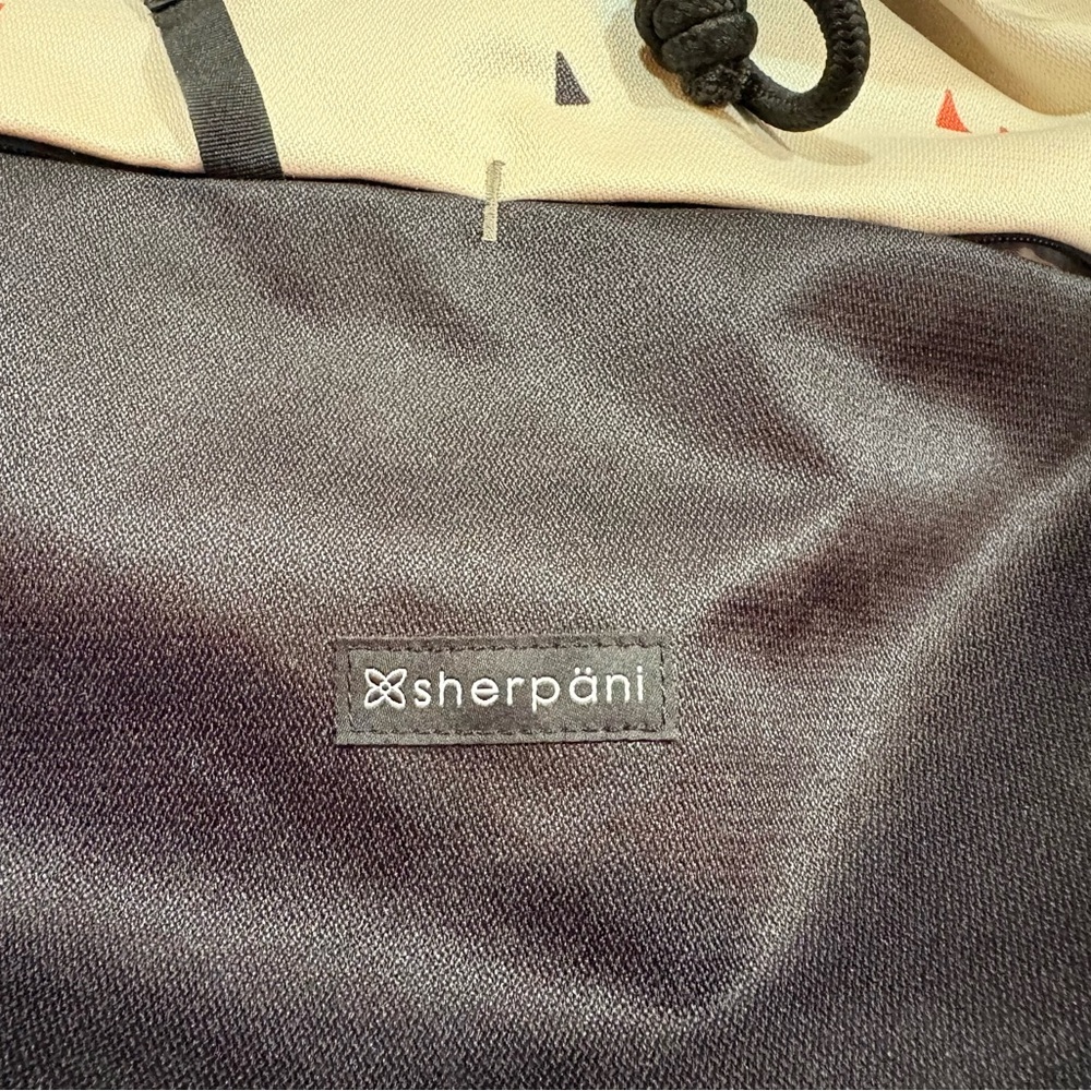Sherpani Black and Cream Triangle Print Backpack - Picture 2 of 15